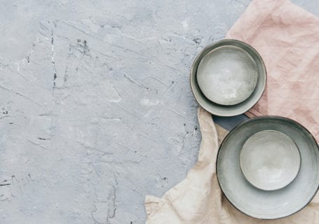 Ceramic bowls on a textured background