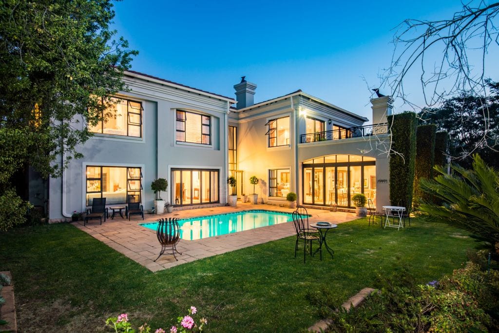 Priced at R8.995 million, this grand mansion offers six bedrooms, four garages, a built-in bar and basement wine cellar, a games room and study. 